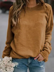 Close-up of a women's brown long sleeve crewneck T-shirt with soft fabric texture