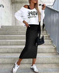 Detailed view of women's casual white sweatshirt and black maxi skirt two-piece set