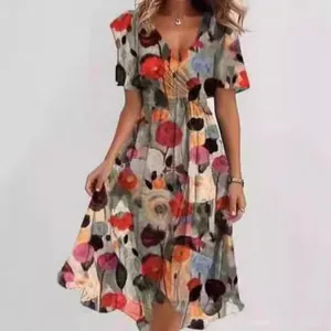 Close-up detail of women's elegant V-neck midi dress with vibrant multi-color floral print