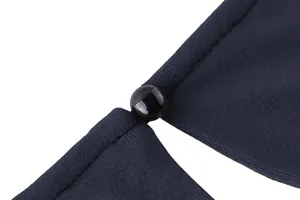 Macro detail of a navy blue sleeveless top featuring a shiny black bead button closure.