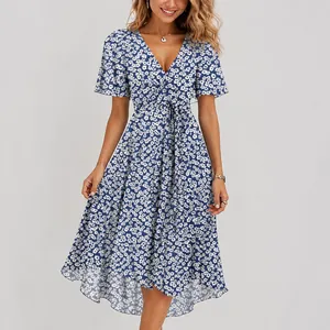 Stylish blue and white floral V-neck summer dress with belt detail on model