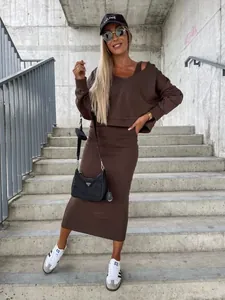 Brown two-piece knit set featuring a cropped hoodie and matching midi skirt for women