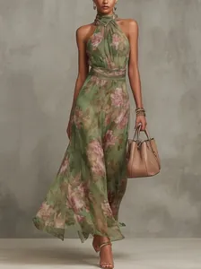 Elegant halter floral mesh maxi dress with a pleated waist and a flowing silhouette
