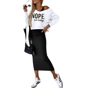 Western style white cropped sweatshirt and black tight maxi skirt two-piece outfit