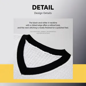 Close-up of men's V-neck knit sweater showing black and white contrast collar detail