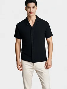 Men's black knitted short sleeve polo shirt with lapel collar and textured pattern