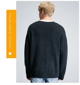 Close-up of the back of a black oversized knitted sweater for men, casual style