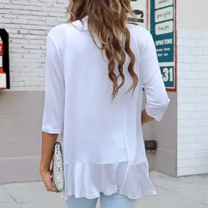 Detail view of the back of a white three-quarter sleeve knit cardigan with ruffled hem