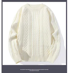 Detailed macro view showing high-quality cable knit texture of this cream men's sweater.