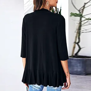Elegant back view of black 3/4 sleeve knit cardigan featuring a stylish ruffled hem detail