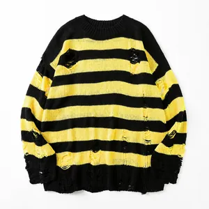 Oversize-Strickpullover mit gelb-schwarzen Streifen und markanten Ripped-Details