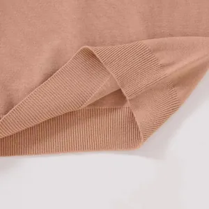 Close-up of the fine ribbed hem and soft knit texture on this casual women's pullover sweater.