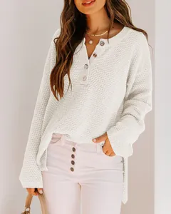 Elegant casual white waffle knit sweater with button-up neckline in a relaxed loose fit style