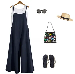 Casual women's loose wide-leg jumpsuit outfit styled with summer travel accessories