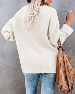 Detailed back view of a cozy cream white oversized waffle knit sweater for casual women's wear
