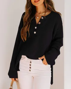 Detail view of casual loose black waffle knit sweater with button-down front for women.