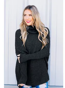 Detail view of women's black chunky knit high-neck sweater with a loose casual fit