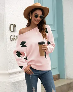 Stylish pink off-shoulder knit sweater featuring black lightning jacquard for autumn
