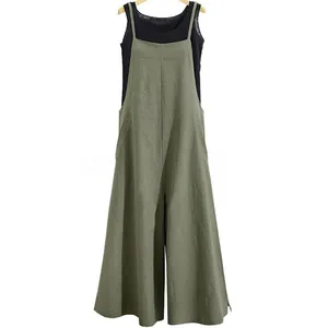 Olive green wide-leg overalls with black sleeveless top on hanger, cotton linen style.