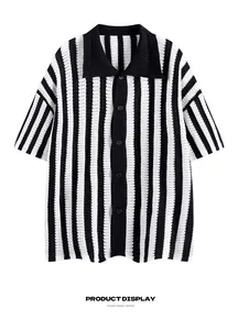 Detail view of the black and white vertical striped knit short sleeve shirt