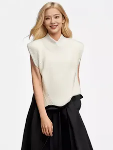 Close-up of an elegant white high-neck sleeveless knit wool sweater vest for women