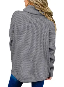 Back view of women's oversized gray turtleneck knitted sweater in a loose fit style