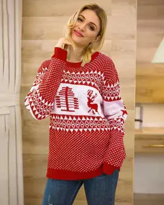 Detailed view of women's red and white festive Christmas sweater with reindeer patterns