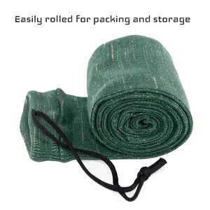 Rolled green knitted gun sock with drawstring for easy storage and packing