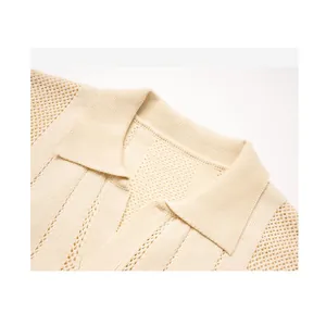 Detailed close-up of men's cream open-knit polo shirt collar with textured pattern