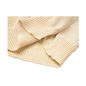 Detail view of a cream men's short sleeve knitted Polo shirt with ribbed cuffs.