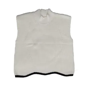 Detail of a white high-neck sleeveless knit vest with a black contrast hem finish.