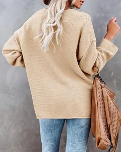 Back view of a casual loose chunky knit beige sweater for women in autumn/winter