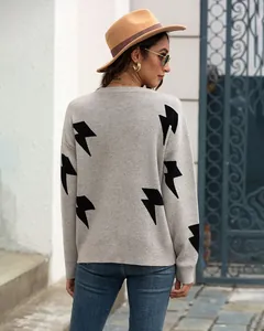 Back view of grey long-sleeved sweater featuring bold black lightning bolt patterns.