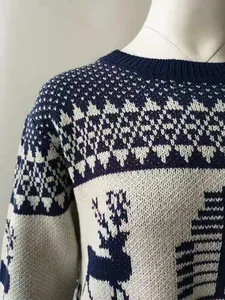 Detailed view of navy blue Christmas sweater with reindeer and geometric patterns