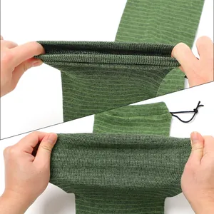 Close-up of flexible green knitted gun sock showing fabric elasticity and drawstring