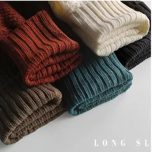 Close-up detail of textured knit cuffs in multiple solid colors for winter sweaters