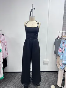 Black halter neck sleeveless jumpsuit with wide-leg pants on a mannequin display