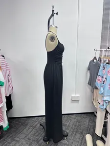 Side profile of a black wide-leg jumpsuit on a mannequin showing ruched waist detail.