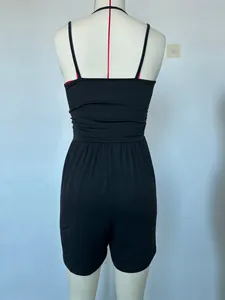 Detailed back view of a minimalist black summer camisole romper for women on a mannequin