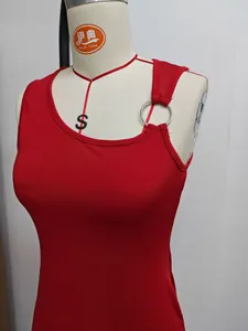 Close-up of red bodycon dress with asymmetric neckline and silver ring detail.