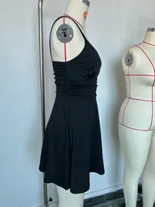 Close-up detail of a black ruched camisole mini dress on a professional tailor mannequin