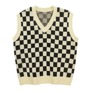Macro view of black and white checkerboard knit sweater vest with V-neckline