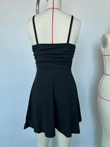Detailed back view of a slim-fit black spaghetti strap cocktail dress on a mannequin