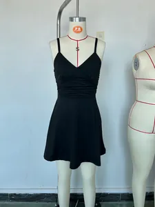Detailed close-up view of a chic black V-neck camisole mini dress on a display mannequin