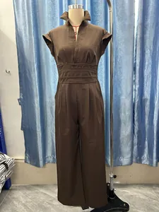 Detailed view of a brown sleeveless v-neck jumpsuit with waist pleats on a mannequin