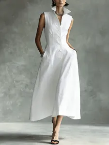 Full-length view of an elegant white sleeveless button-up midi dress with stand-up collar.