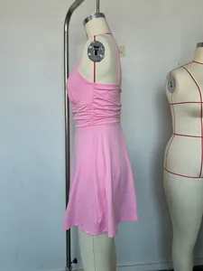 Side view detail of a pink ruched sleeveless summer dress on a professional dress form