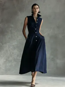 Detail view of a stylish navy blue sleeveless button-down maxi dress with a classic collar.