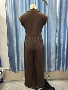 Back view of brown smocked sleeveless jumpsuit with wide-leg design on mannequin