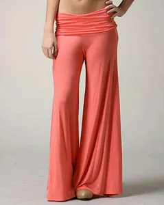 Detailed view of coral orange wide-leg yoga pants with a comfortable high waistband